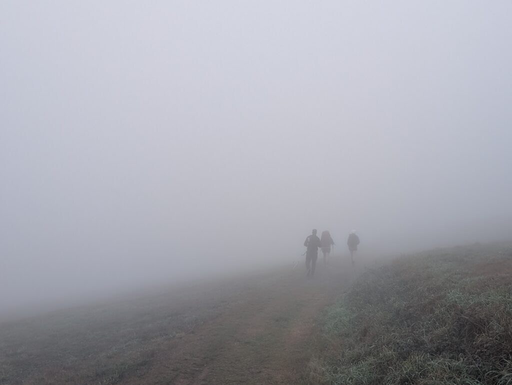 Hiking out of Grandas in the fog towards A Fonsagrada